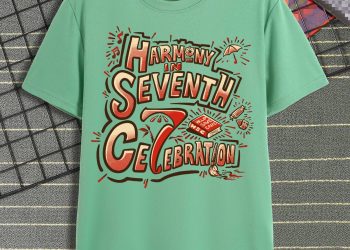 "Kaos berwarna hijau mint dengan desain tipografi meriah bertuliskan 'Harmony in Seventh Celebration', dibuat untuk memperingati ulang tahun ke-7 Payungi dengan semangat Help, Save & Care."